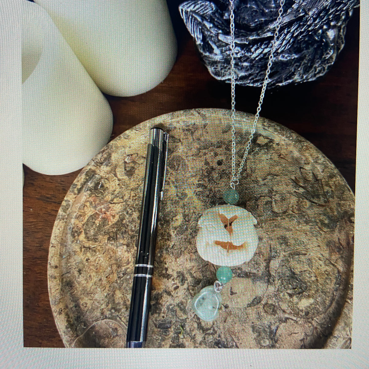 RESTING DEER HAND CARVED PENDENT